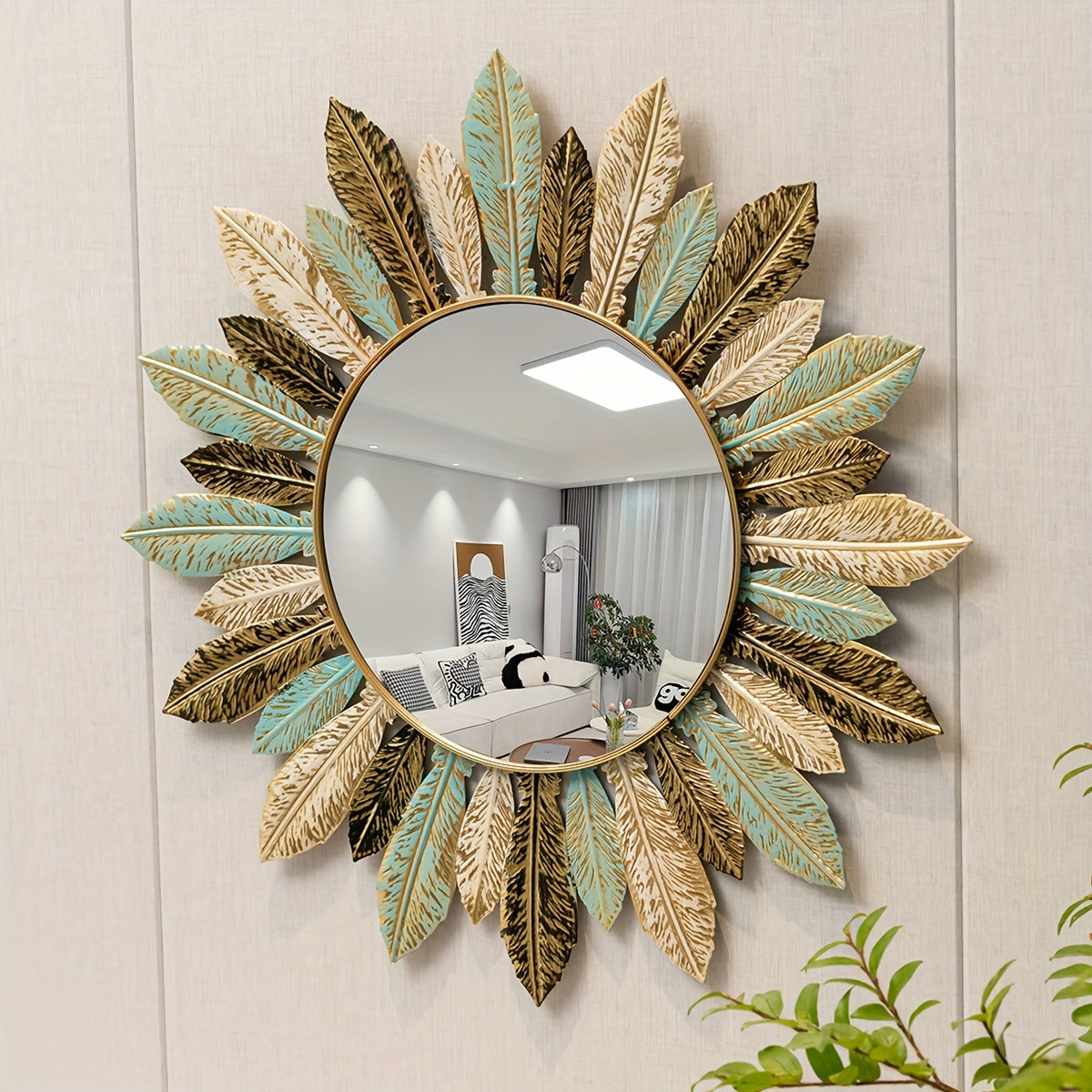Bohemian sunburst metal wall mirror in teal and gold leaf finish